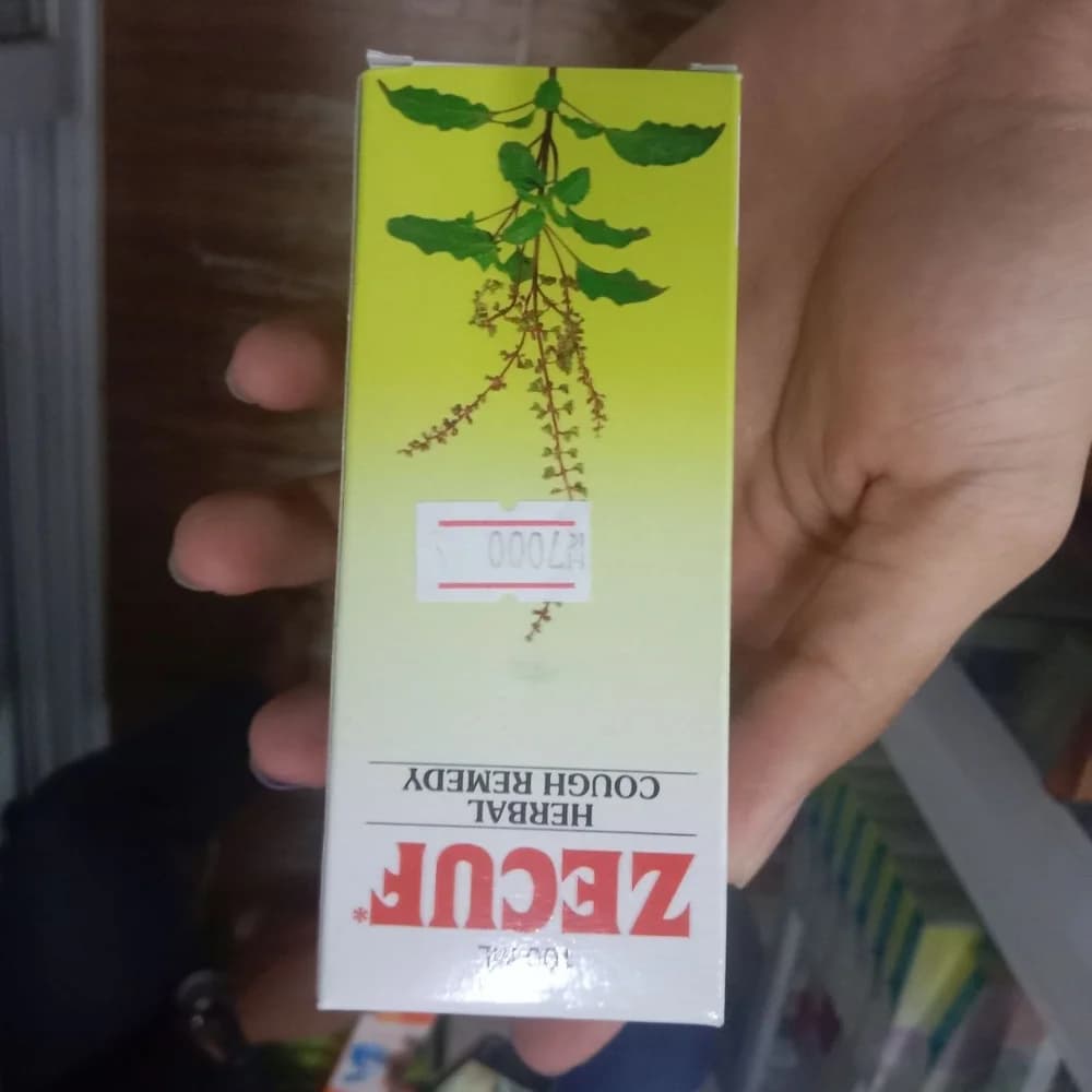 Zecuf Herbal Cough Remedy Per 10 ml: Ocimum sanctum 100 mg, Glycyrrhiza glabra 60 mg, Curcuma longa 50 mg, Zingiber officinale 10 mg, Adhatoda vasica 60 mg, Solanum indicum 20 mg, Inula racemosa 20 mg, Piper cubeba 10 mg, Terminalia belerica 20 mg, Aloe barbadensis 50 mg, and menthol 6 mg