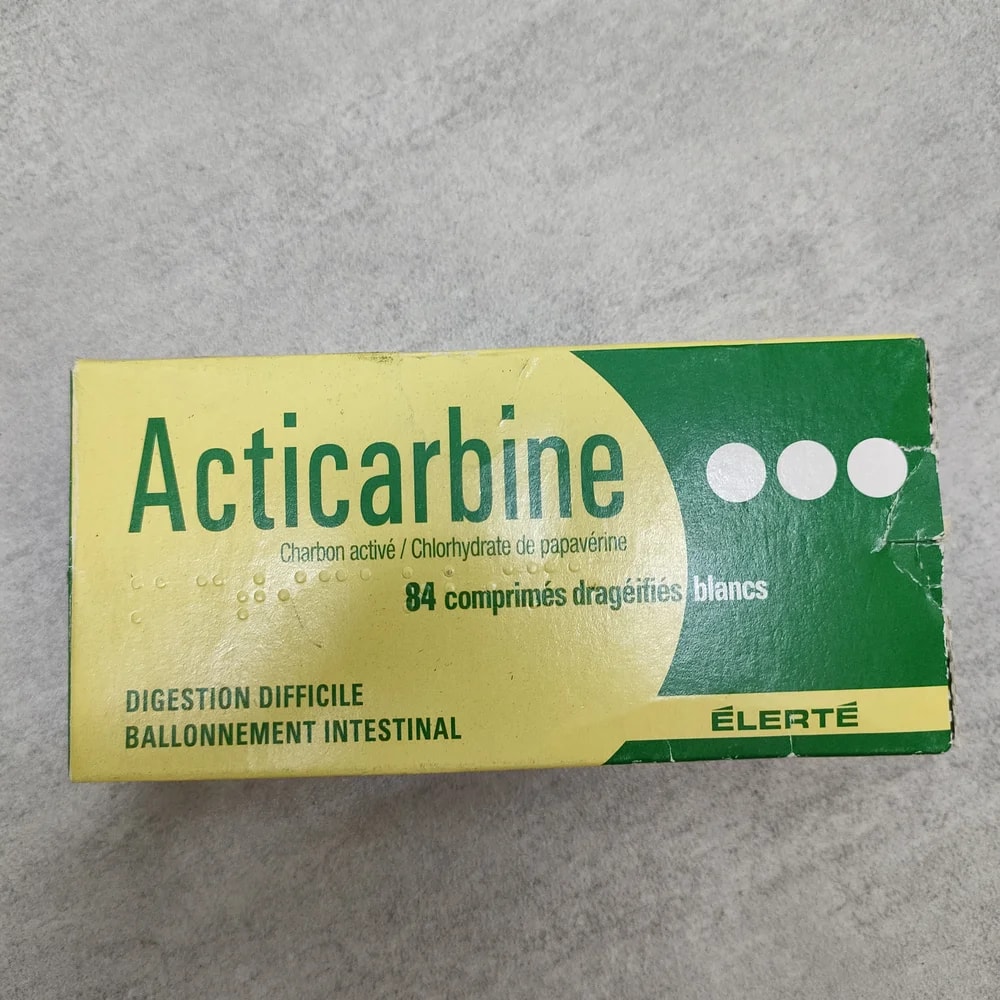 Acticarbine Papaverine HCl 14 mg / Activated charcoal 70 mg per coated tablet - Depot De Pharmacie "A" Kim Houy