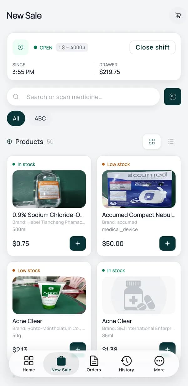 New Sale screen in the PharmKulen Business app: search or scan a medicine, with in-stock and low-stock product cards priced in US dollars.
